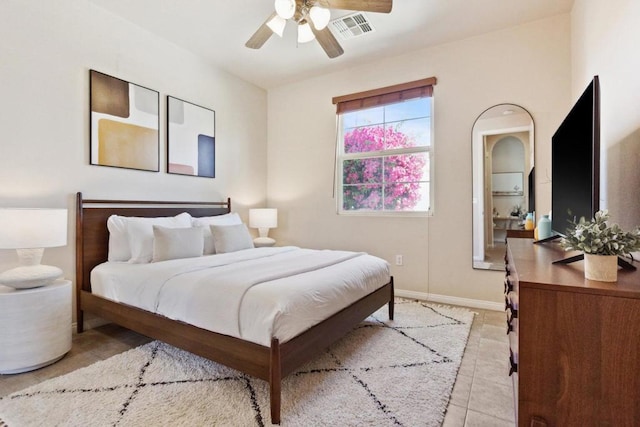 tiled bedroom with ceiling fan