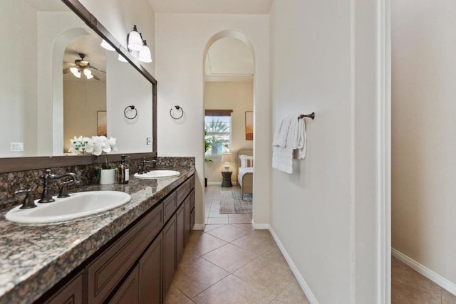 bathroom featuring ceiling fan, tile patterned floors, and vanity