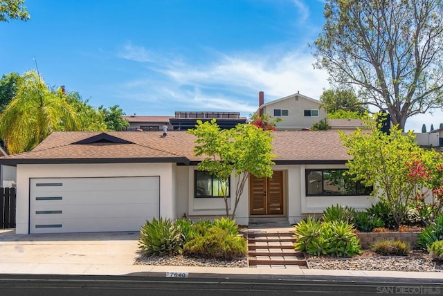 view of front of home featuring a garage and french doors