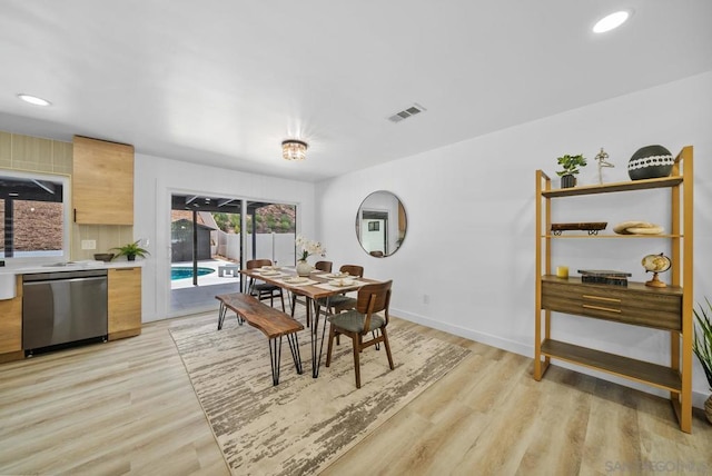 dining room with light hardwood / wood-style flooring