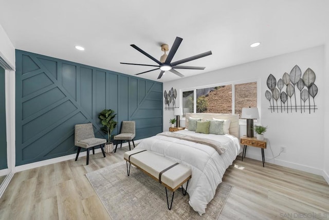 bedroom featuring light hardwood / wood-style flooring and ceiling fan