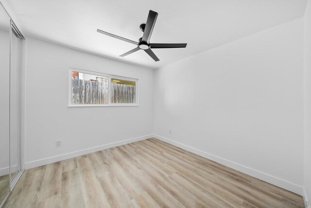 unfurnished room with light hardwood / wood-style floors and ceiling fan