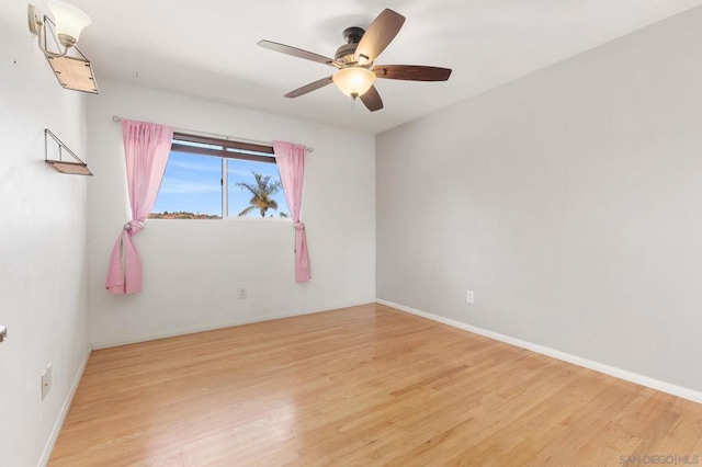 spare room with ceiling fan and light hardwood / wood-style flooring