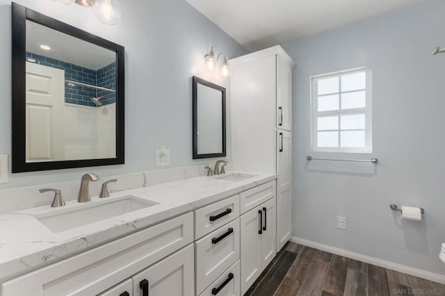 bathroom with a shower and vanity