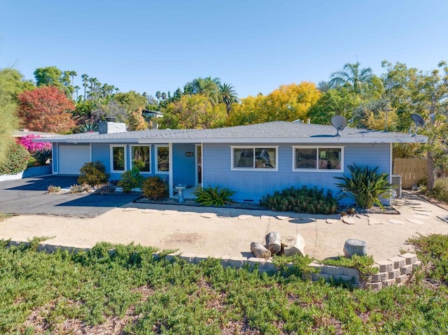 ranch-style home featuring a garage