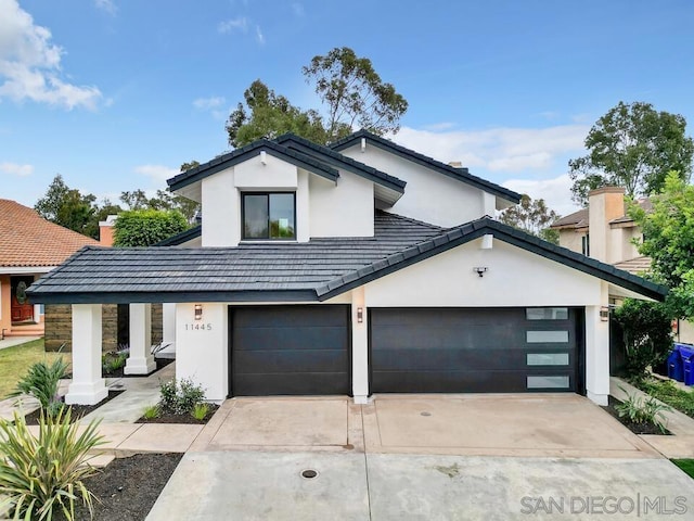 view of front of property with a garage