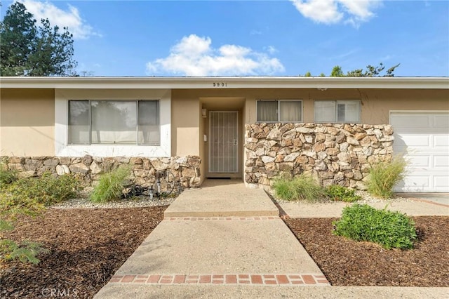 entrance to property featuring a garage