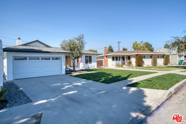 ranch-style home featuring a front lawn and a garage