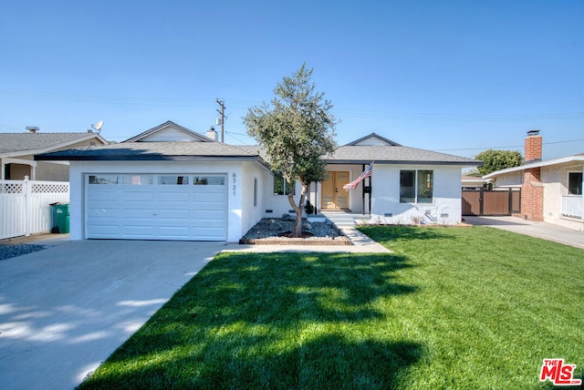 ranch-style home featuring a garage and a front yard