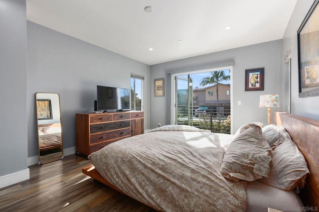 bedroom featuring access to exterior and dark hardwood / wood-style floors