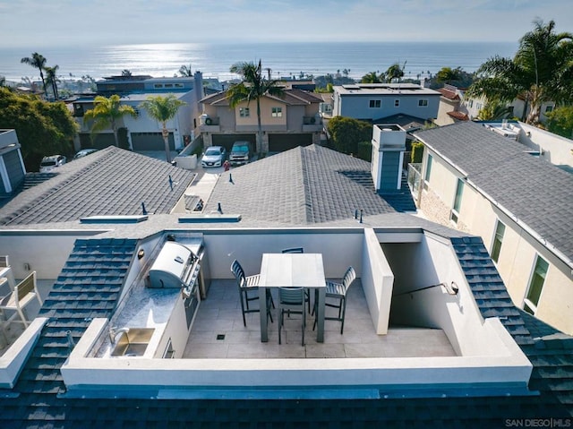 rear view of house with a water view