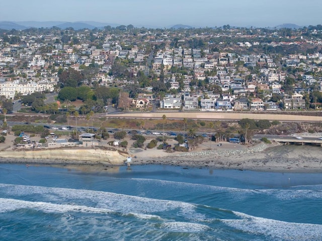 aerial view with a water view and a view of the beach