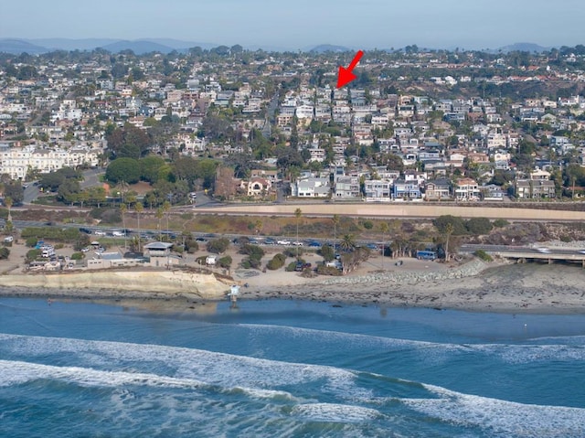 bird's eye view with a beach view and a water view