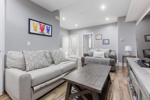 living room with light hardwood / wood-style flooring