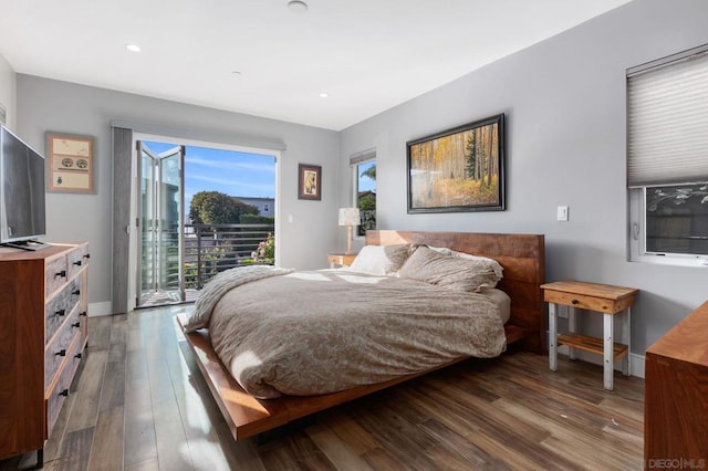 bedroom with access to outside and hardwood / wood-style flooring