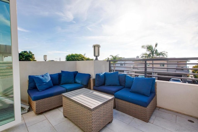 view of patio featuring an outdoor hangout area and a balcony