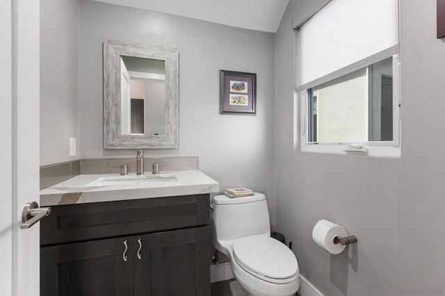 bathroom with toilet and vanity