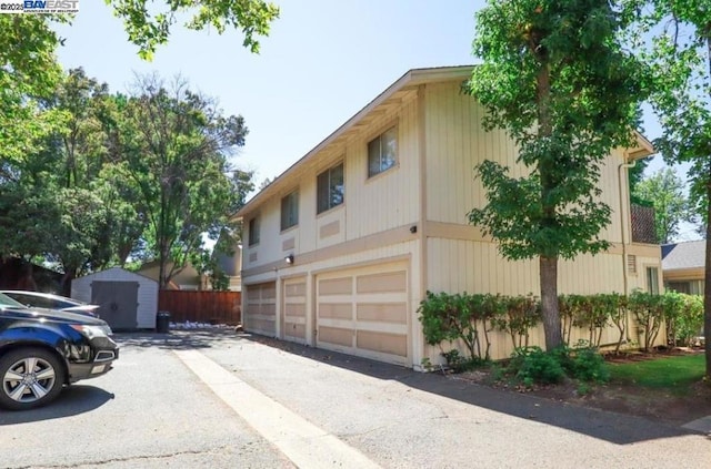 view of side of property with a garage