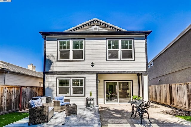 back of property featuring a patio, an outdoor hangout area, and central AC unit