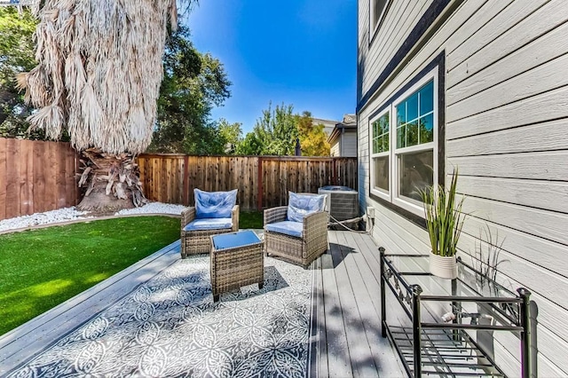 wooden terrace featuring an outdoor living space, a lawn, and central air condition unit