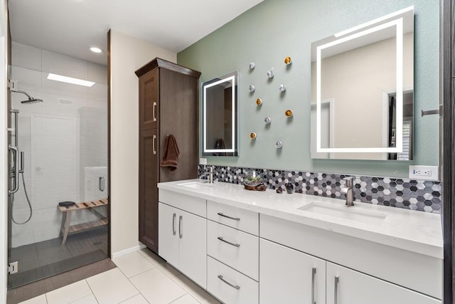 bathroom with vanity, tile patterned flooring, and an enclosed shower