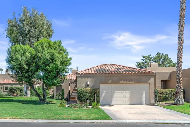 view of front of house featuring a garage and a front yard