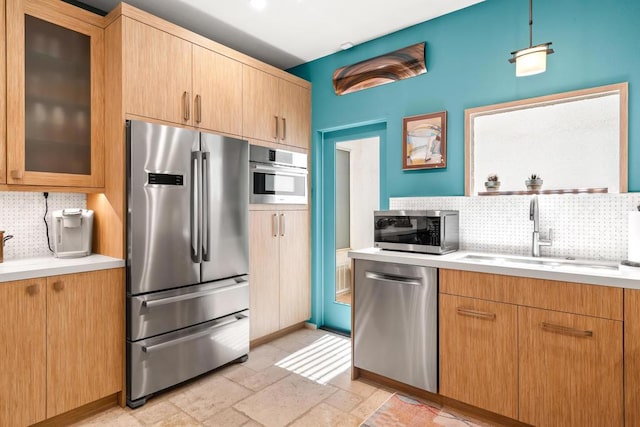 kitchen with sink, backsplash, and stainless steel appliances