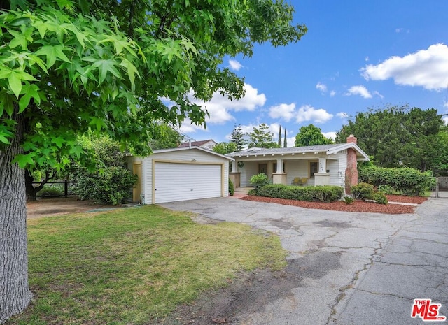 ranch-style home with a garage and a front yard