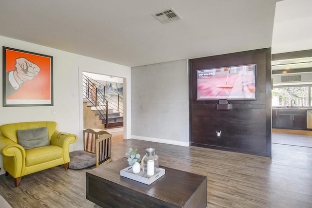 living room with sink and hardwood / wood-style floors