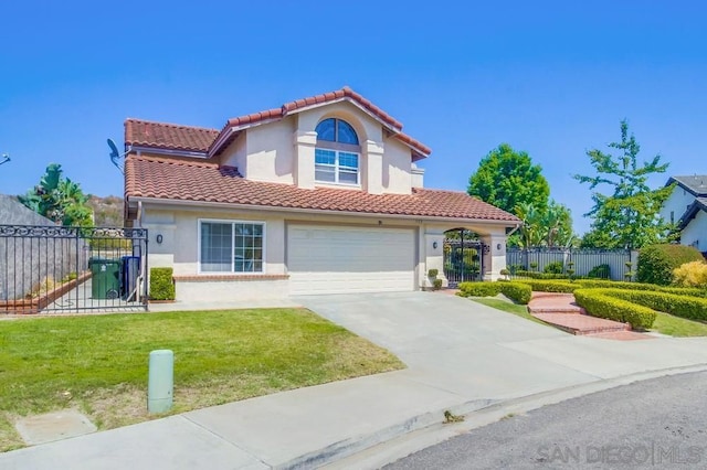 mediterranean / spanish-style house featuring a front lawn and a garage