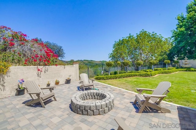 view of patio / terrace with an outdoor fire pit