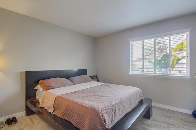 bedroom featuring light wood-type flooring