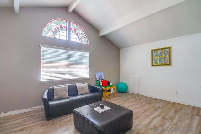 living room with light wood-type flooring and lofted ceiling with beams