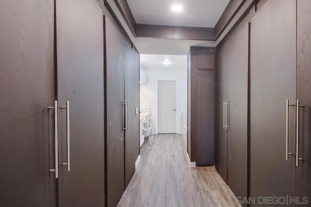 hall with light hardwood / wood-style flooring