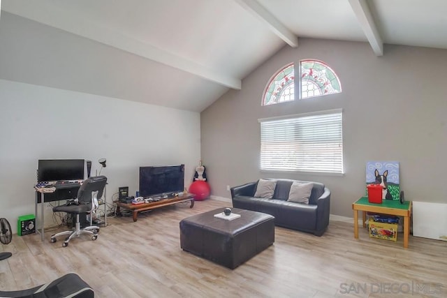 living room featuring hardwood / wood-style floors and lofted ceiling with beams