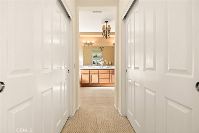 corridor with light tile patterned floors