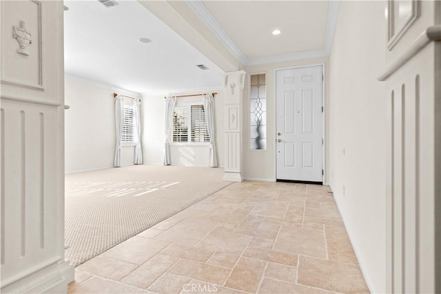 foyer featuring ornamental molding