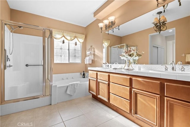 bathroom with vanity, shower with separate bathtub, tile patterned flooring, and a notable chandelier