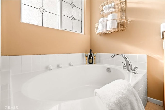 bathroom with tiled tub