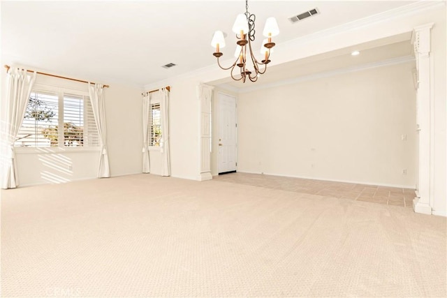 unfurnished room with ornamental molding, light colored carpet, and a notable chandelier