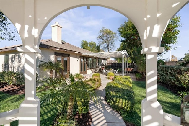 surrounding community featuring a pergola and a patio area