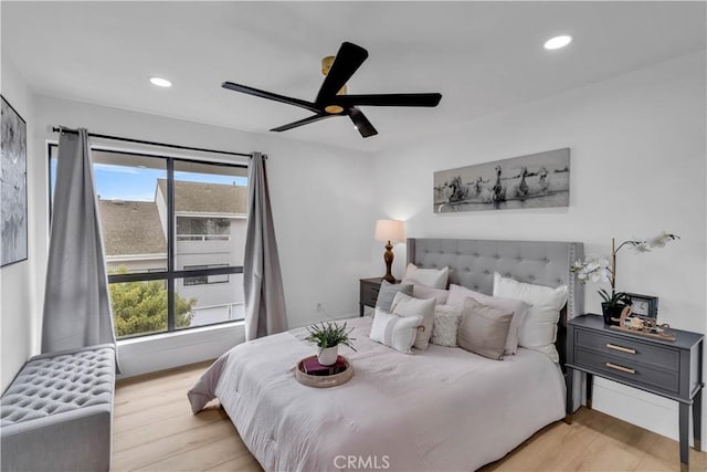 bedroom featuring ceiling fan and light hardwood / wood-style flooring