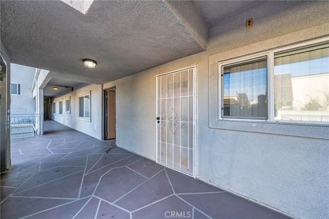 doorway to property with a patio area