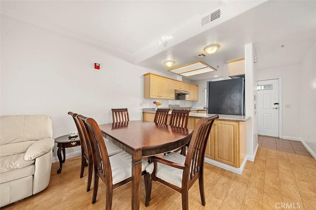 dining room with light hardwood / wood-style floors