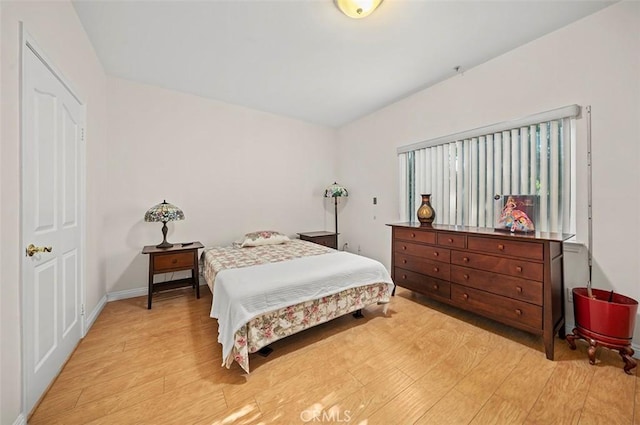 bedroom with light wood-type flooring