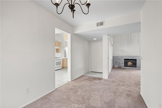 interior space with light carpet and an inviting chandelier