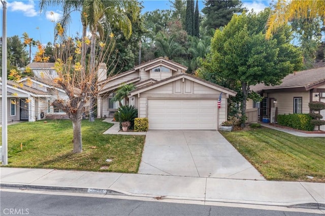 view of front of property with a garage and a front yard