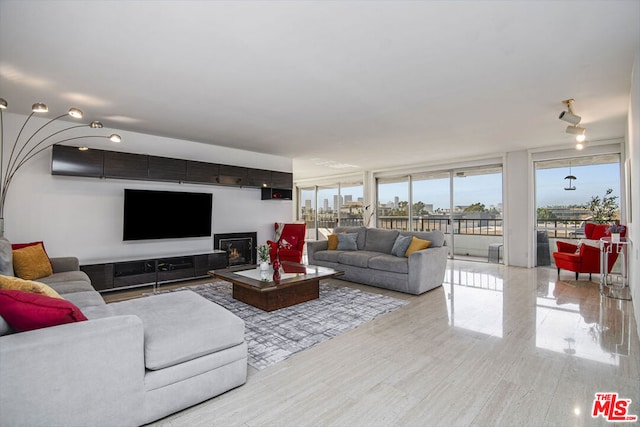 living room featuring a wall of windows