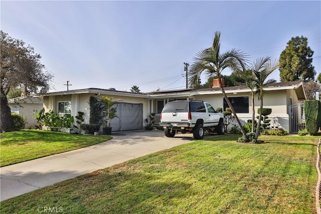 single story home with a front yard and a garage