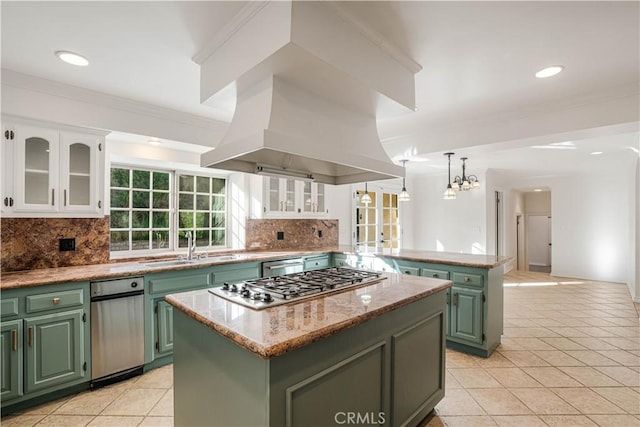 kitchen with light tile patterned flooring, green cabinetry, a center island, and white cabinets